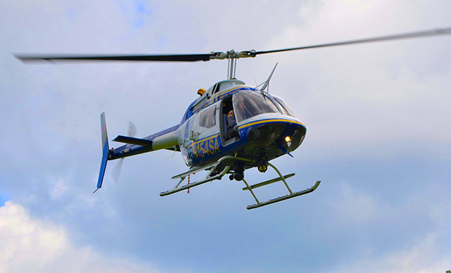 A rescue helicopter flying in the air